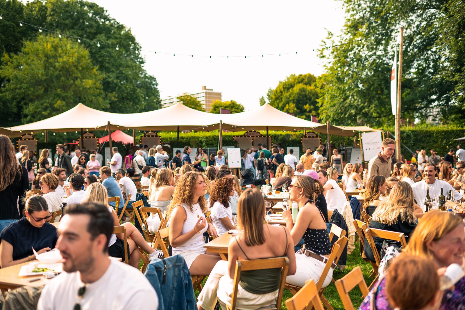 Guests seated outside at Amsterdam Wine Festival.