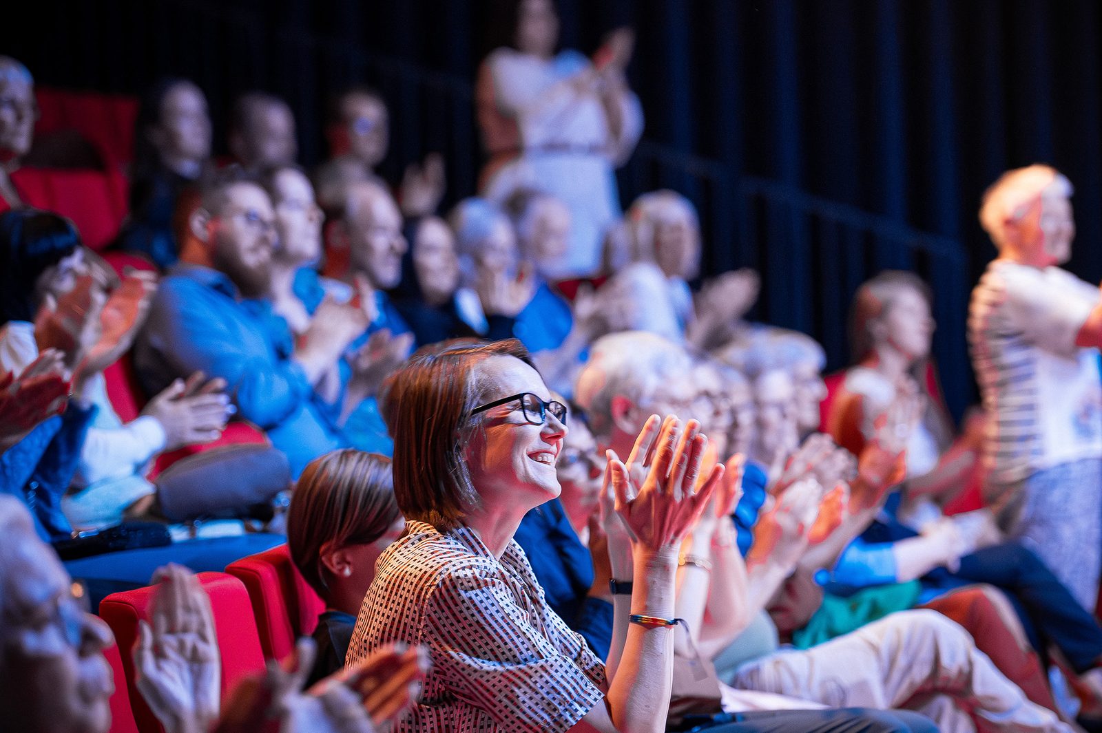 Audience applauding during a Ukrainian International Ballet event.