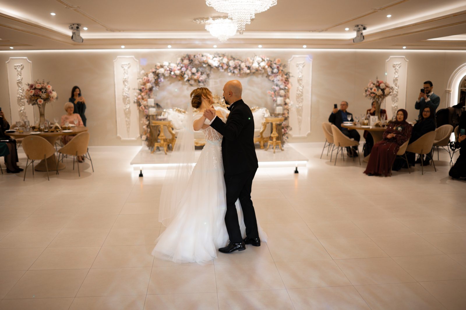 Bride and groom dancing together during a wedding reception.